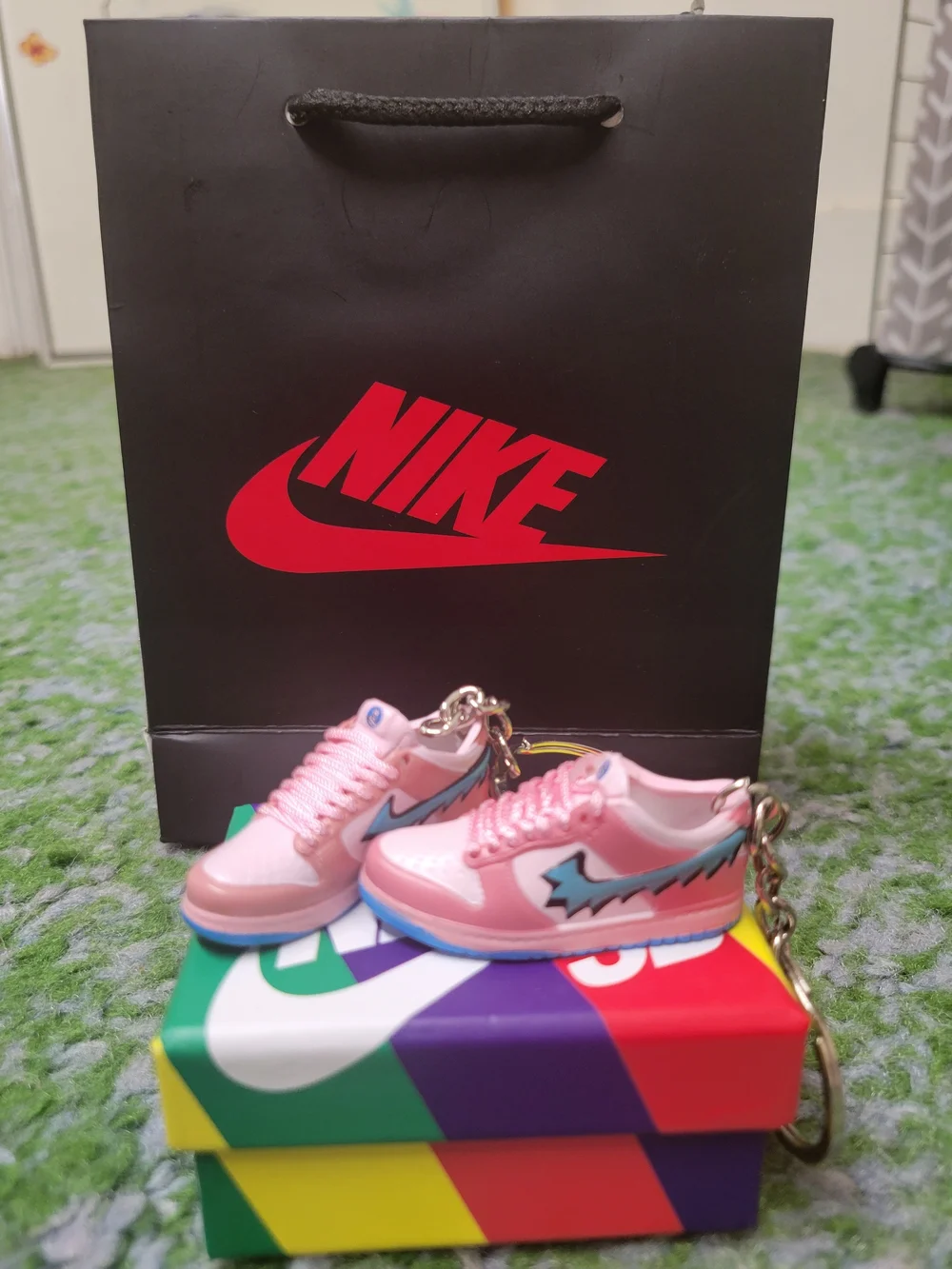 Nike Pink Mini Sneaker Keychain with Blue Accent